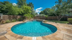 Round pool with steps and tropical landscaping